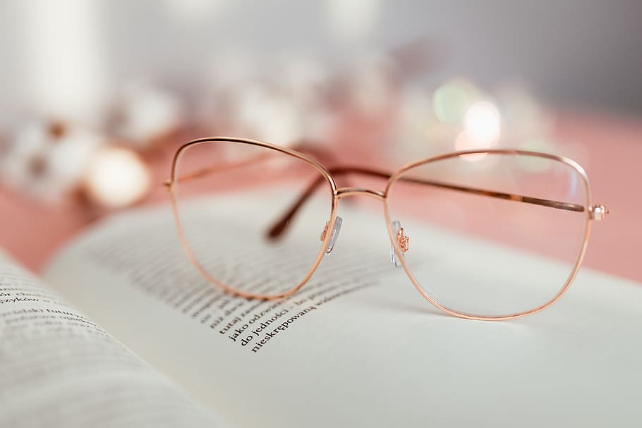 Open book on a pink background, reading, glasses, learning, pink backgound