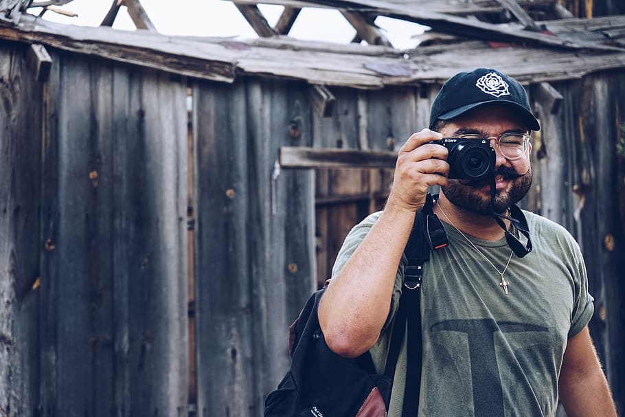 man holding camera, person, human, photographer, electronics HD wallpaper