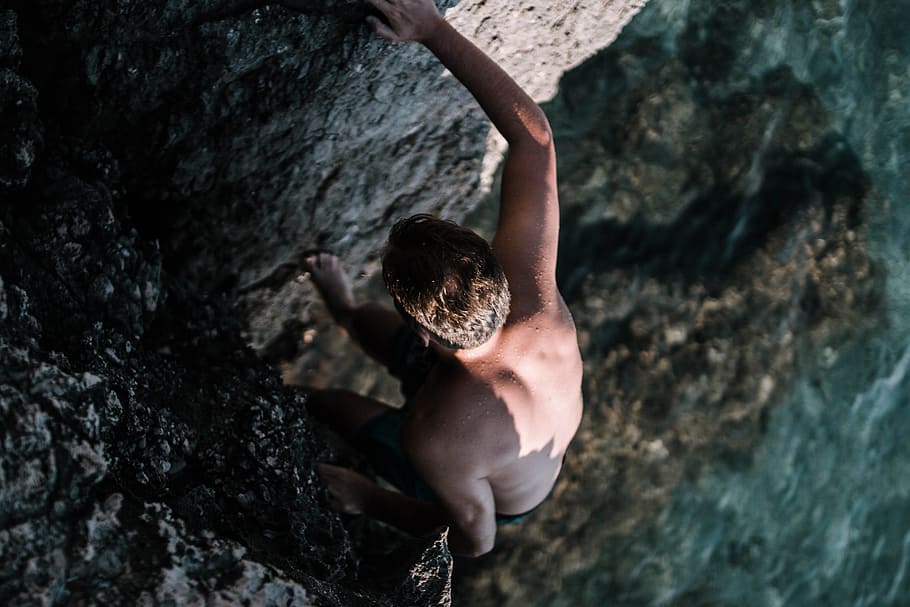 Man Climbing On Cliff, climber, explore, outdoors, person, rock HD wallpaper