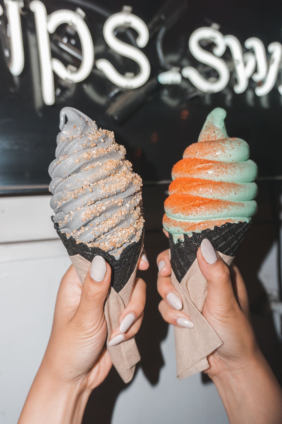 two assorted-flavor ice cream in cones, human hand, holding, food and drink HD wallpaper