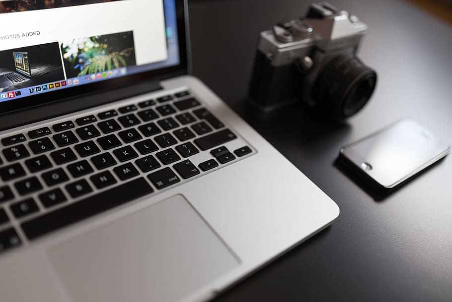 Silver Laptop Computer Beside of White and Black Camera and Black Iphone HD wallpaper