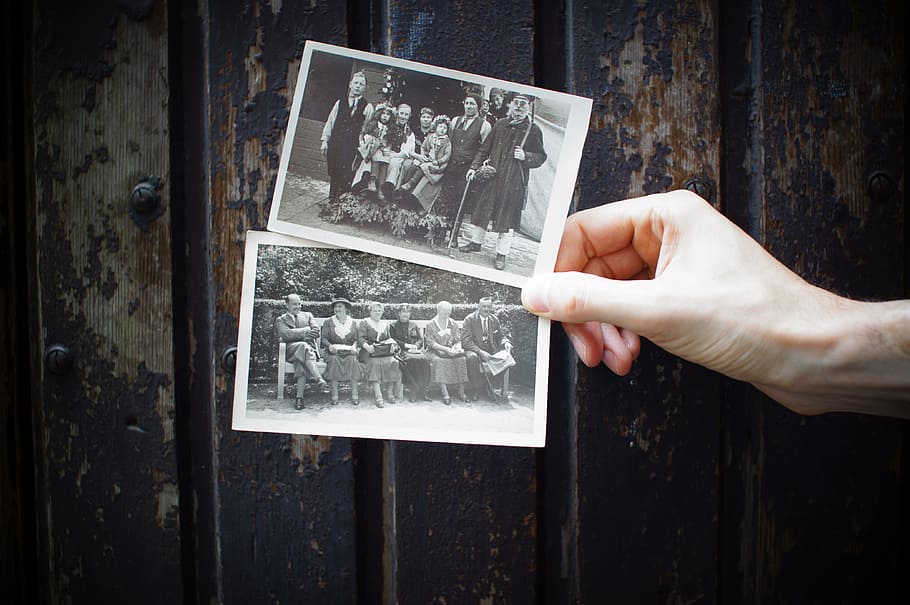 person holding vintage photos, hand, family, photograph, media