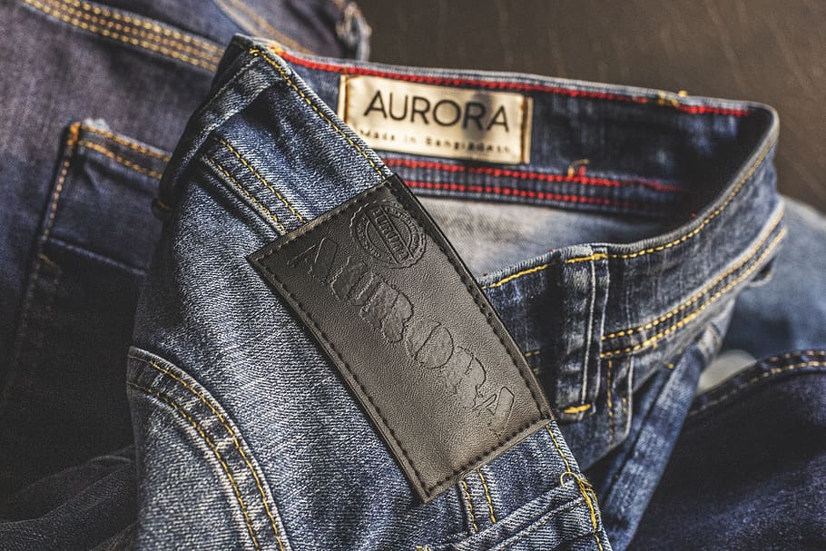 Blue Aurora Denim Bottoms on Brown Wooden Surface, apparel, blue jeans