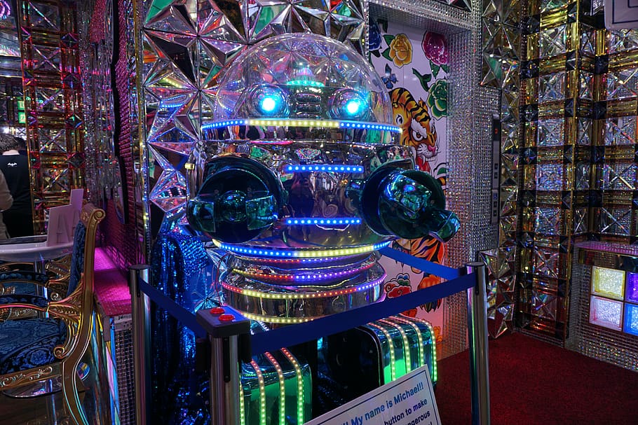 lighting, arcade game machine, person, human, robot, exhibition