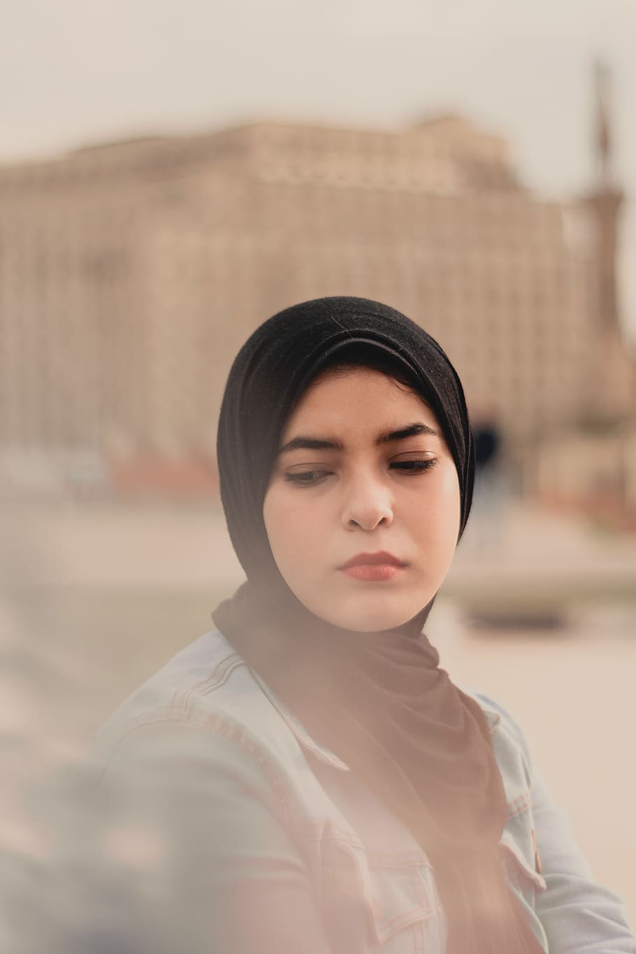 woman wearing black hijab during daytime, clothing, apparel, person