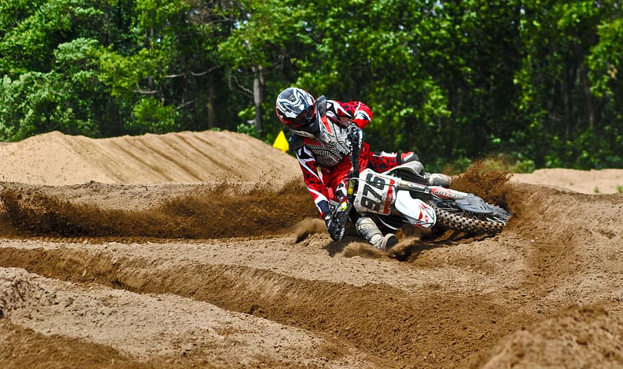 Person Driving Dirt Motorcycle on Sandy Stadium, action, adventure HD wallpaper