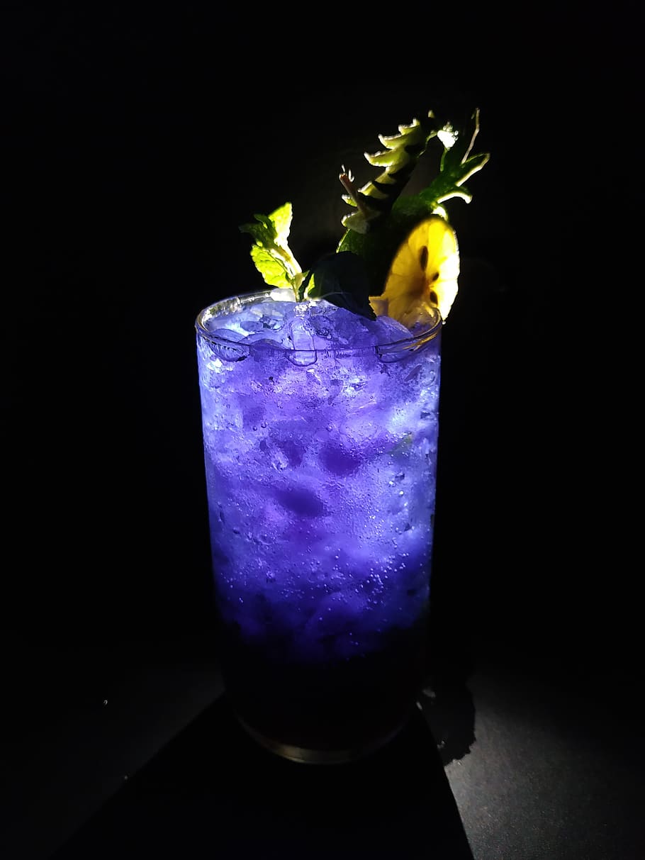 Glass of Blue Curacao With Ice, alcoholic beverage, black background