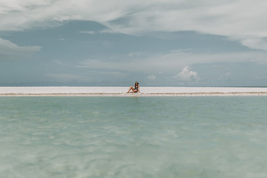 Person Sitting On White Sand , beach, ocean, sea, seascape, seashore HD wallpaper