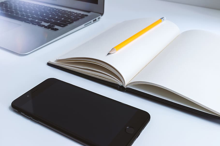 Work table in the office with laptop and smartphone, technology HD wallpaper