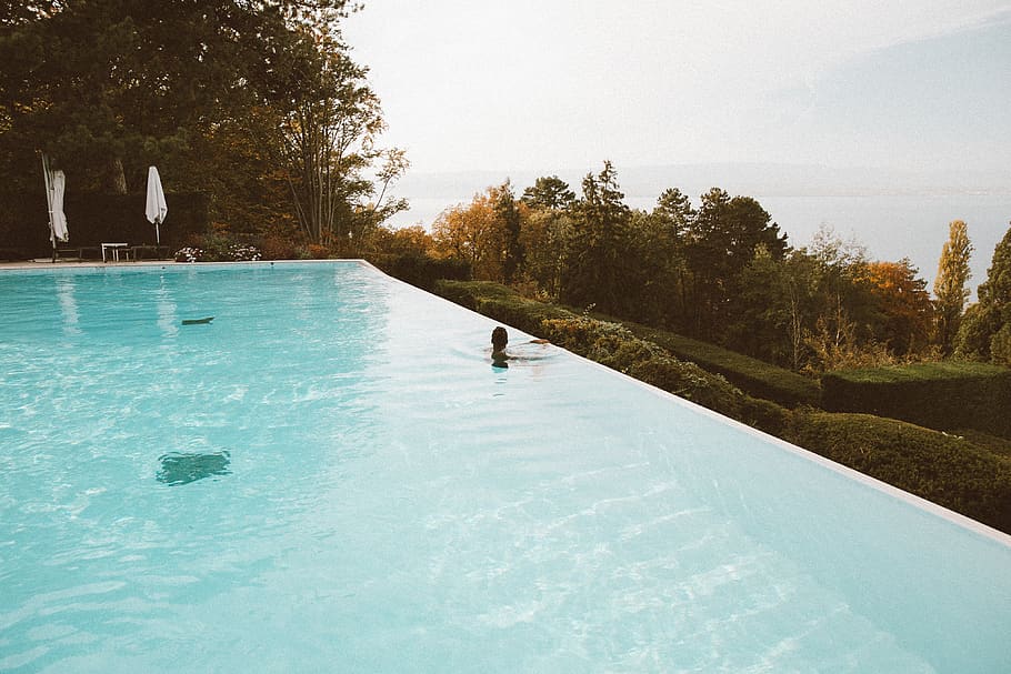 person in swimming pool, water, tree, plant, nature, beauty in nature HD wallpaper