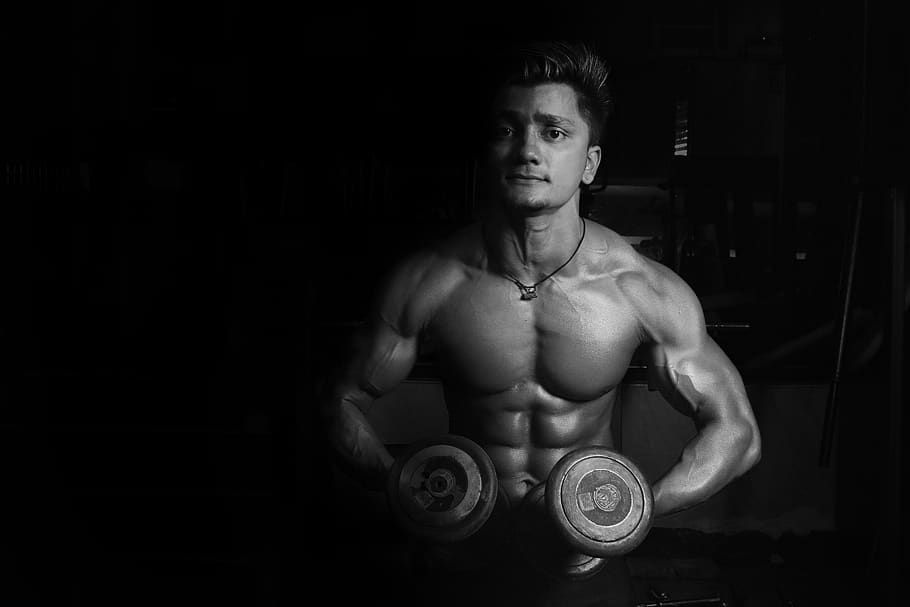 Grayscale Photo of a Man Holding Pair of Dumbbells, black and white