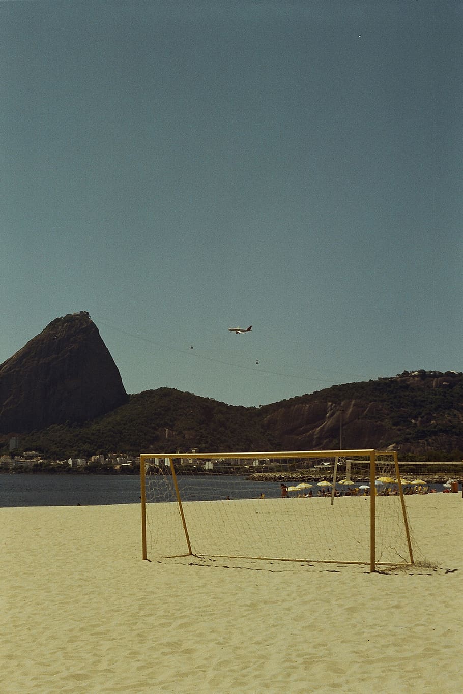 Goal Net By The Seashore, beach, ocean, sand, sky, water, mountain HD wallpaper