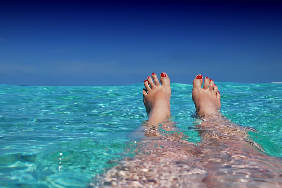 Woman in Body of Water, beach, blue, feet, female, floating, fun, HD wallpaper