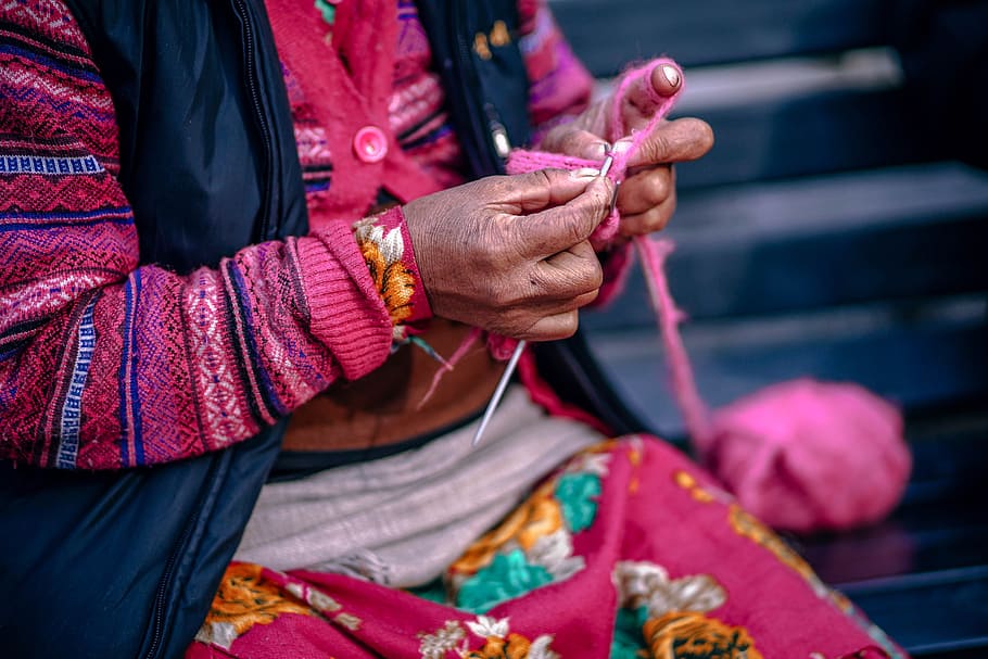 selective focus photography of woman knitting pink yarn, person HD wallpaper
