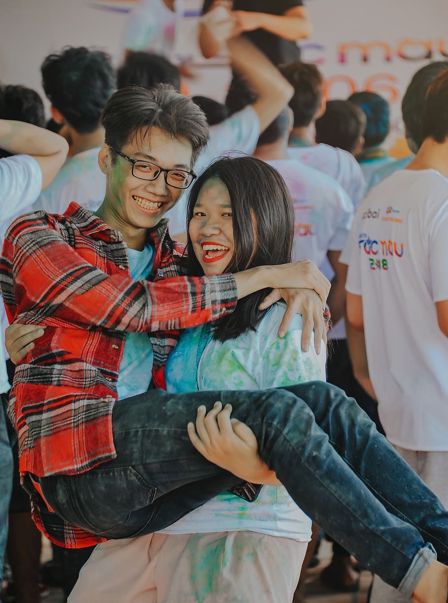 Woman Carrying Man, adolescent, crowd, cute, daylight, education HD wallpaper
