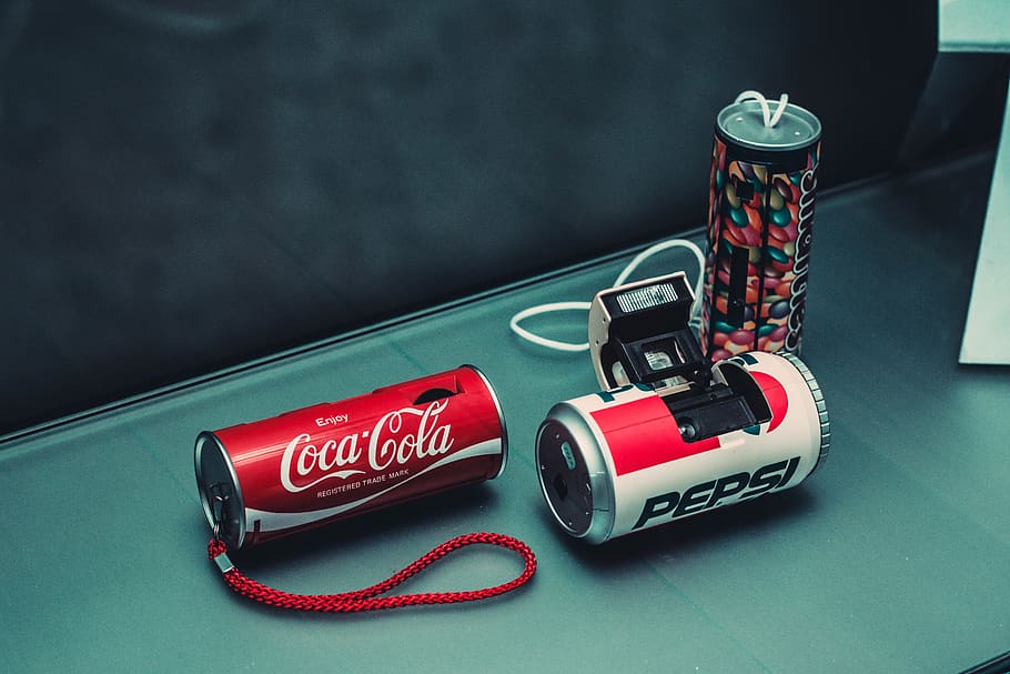 three assorted-color beverage can cameras, still life, no people HD wallpaper