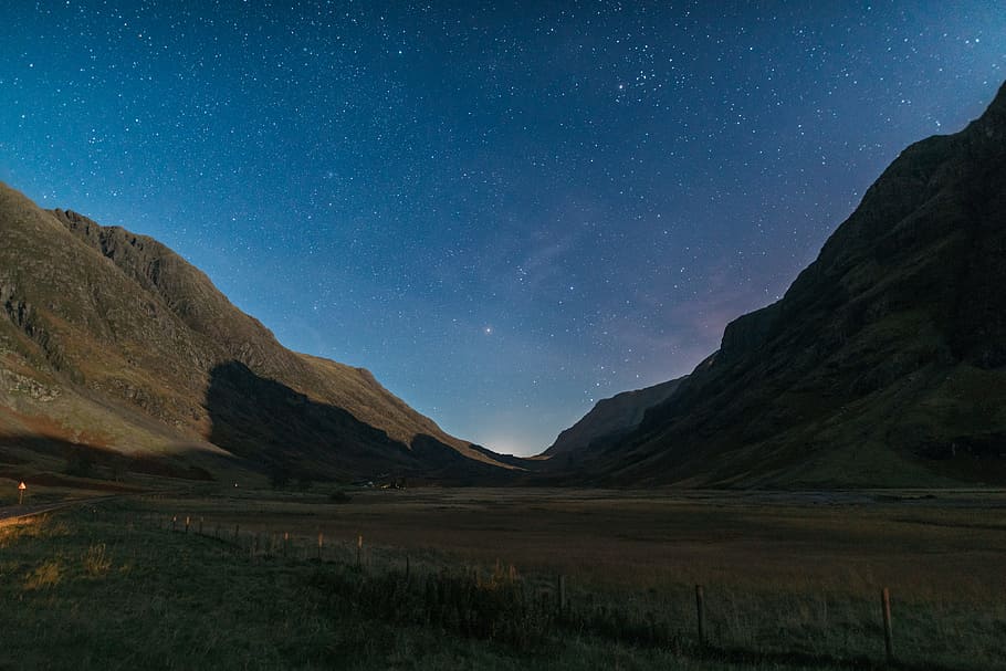 man, stars, shadow, field, grass, landscape, mountain, nature HD wallpaper