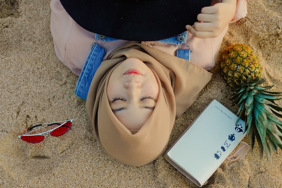 Woman Lying on Sand Beside Sunglasses, adult, beach, beautiful, HD wallpaper