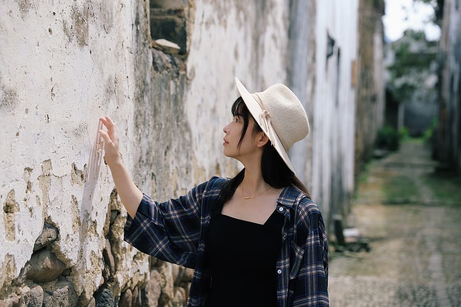 selective focus photography of woman touching wall, person, human