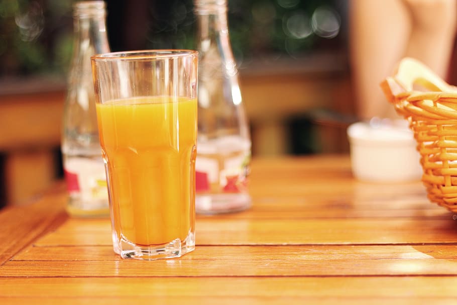 Clear Drinking Glass Filled With Yellow Liquid, orange juice HD wallpaper