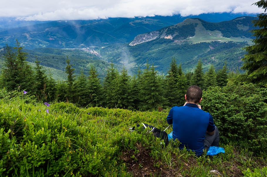 Man Wearing Blue Shirt Sitting On Green Grass, adventure, daylight HD wallpaper