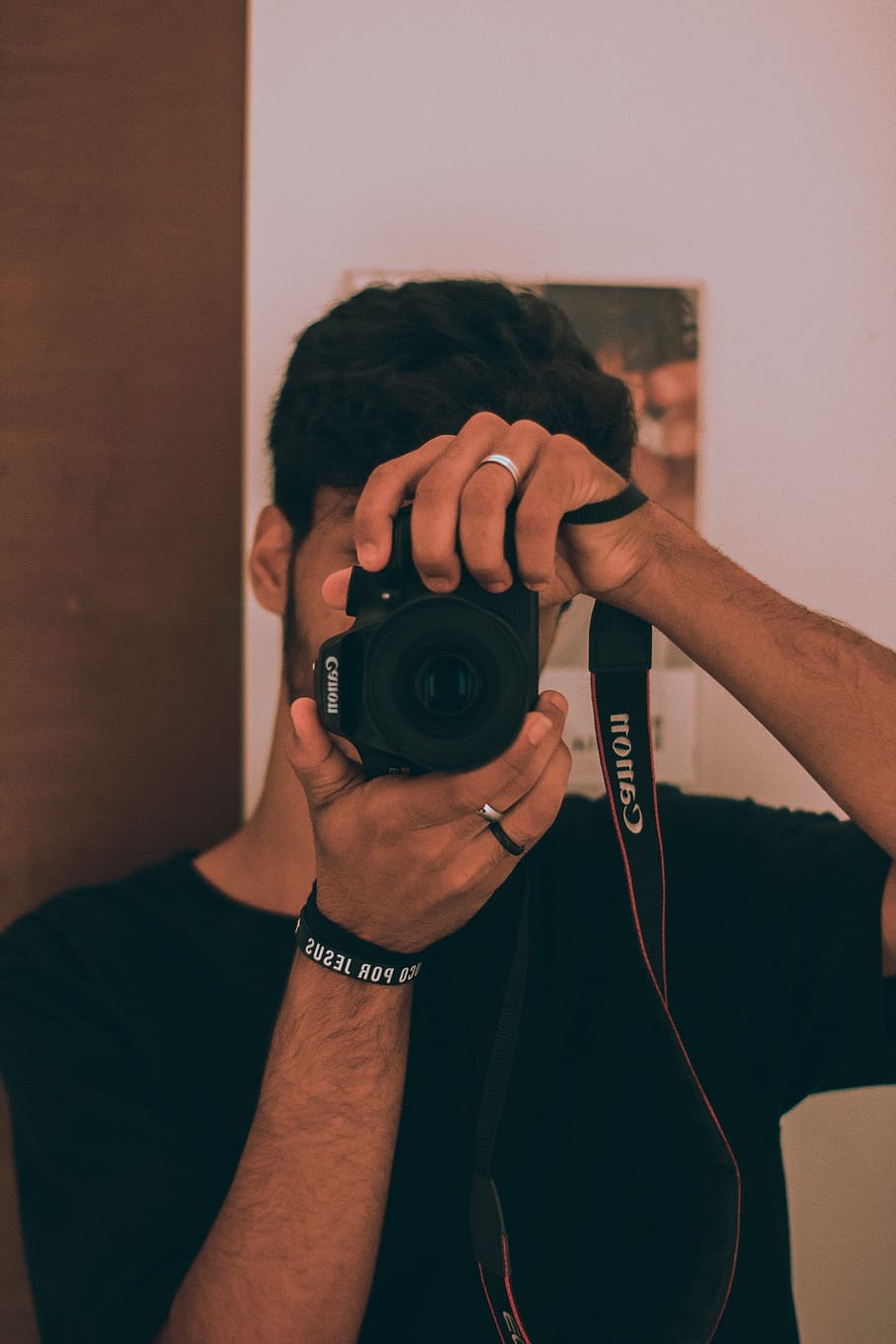 man holding black Canon DSLR camera, human, person, electronics HD wallpaper