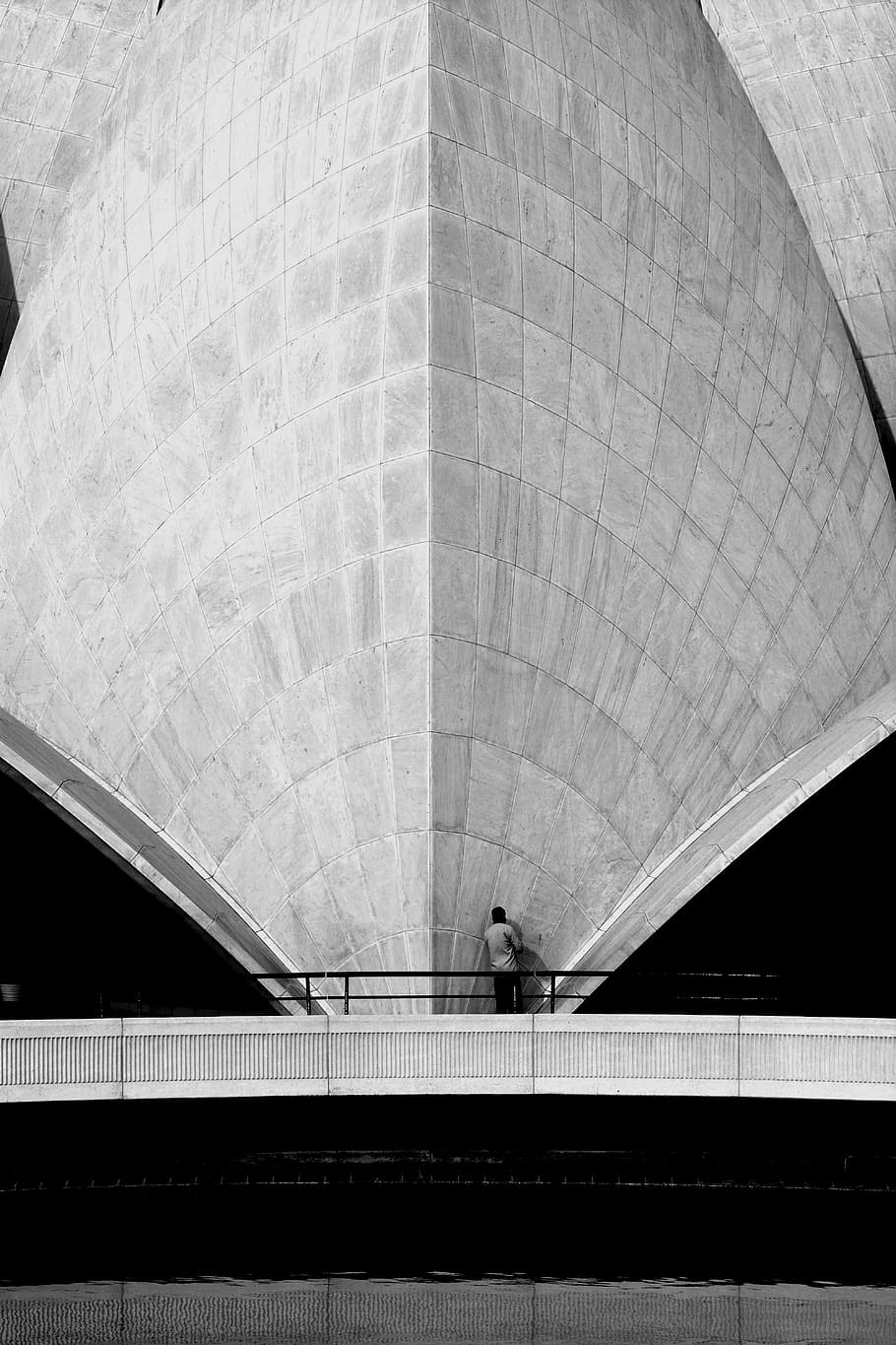 person beside gray building, human, india, new delhi, concrete