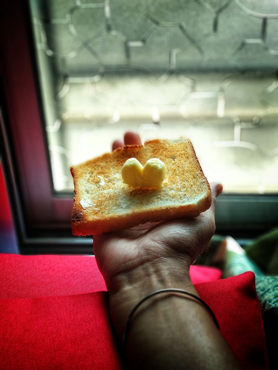 Person Holding Toast With Butter on Top, bread, dairy product