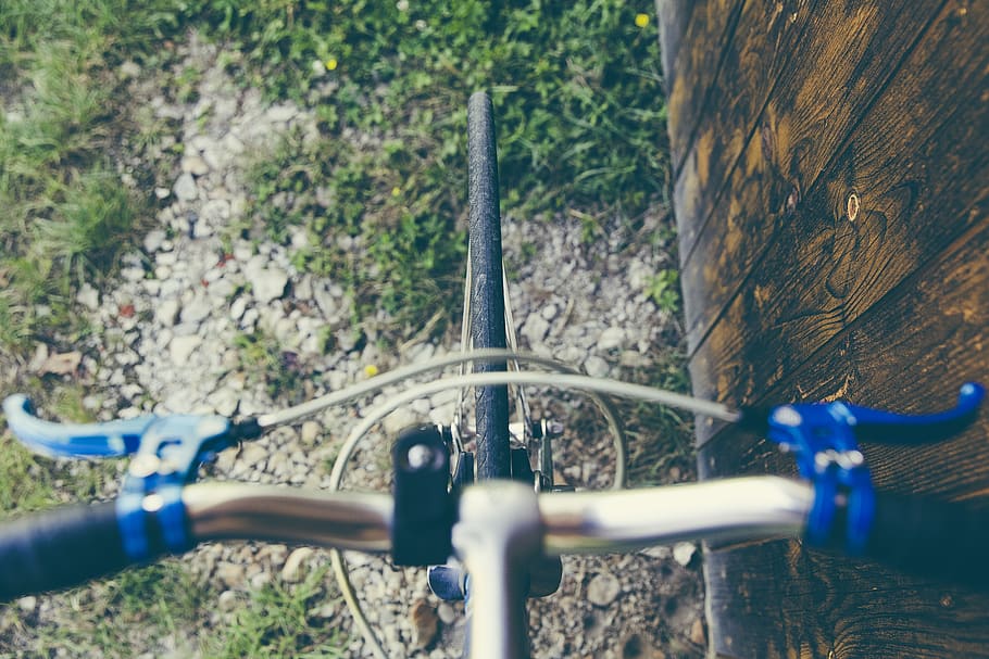 Top View of Road Bicycle Front Tire, brake levers, grass, handle bar HD wallpaper