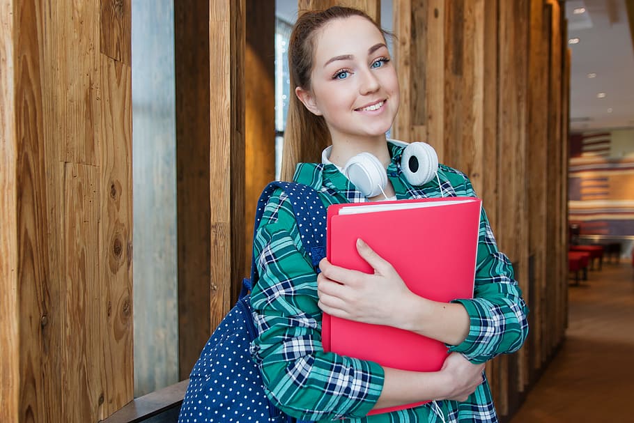 Woman Standing in Hallway While Holding Book, adolescent, attractive HD wallpaper