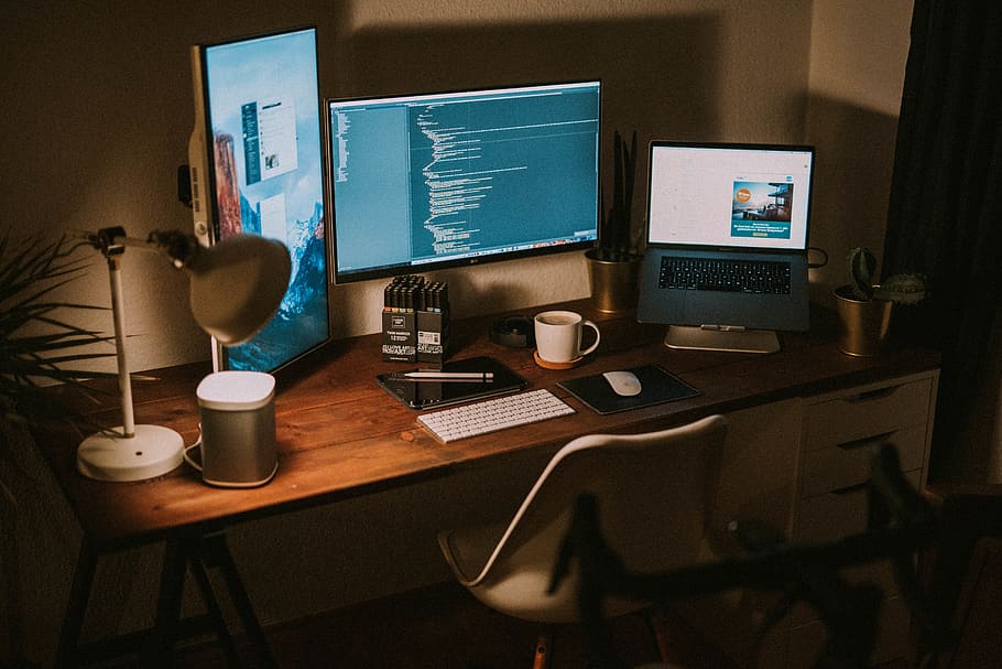 turned on flat screen monitors and MacBook Pro, technology, table HD wallpaper