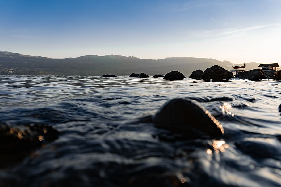 rocks in shallow river, water, sky, no people, sea, scenics - nature HD wallpaper