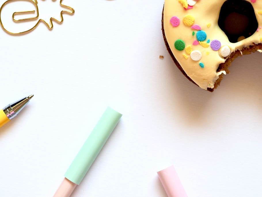 bite, donut, breakfast, food, yellow, sprinkle, pen, white HD wallpaper