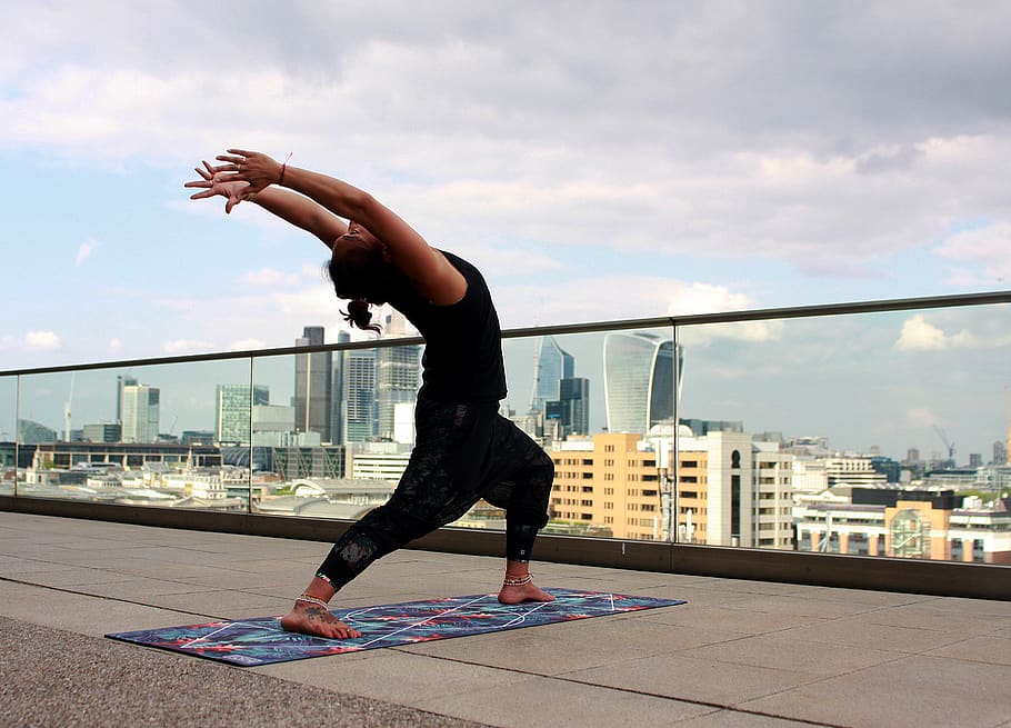 man doing yoga on rooftop, sky, architecture, city, one person HD wallpaper