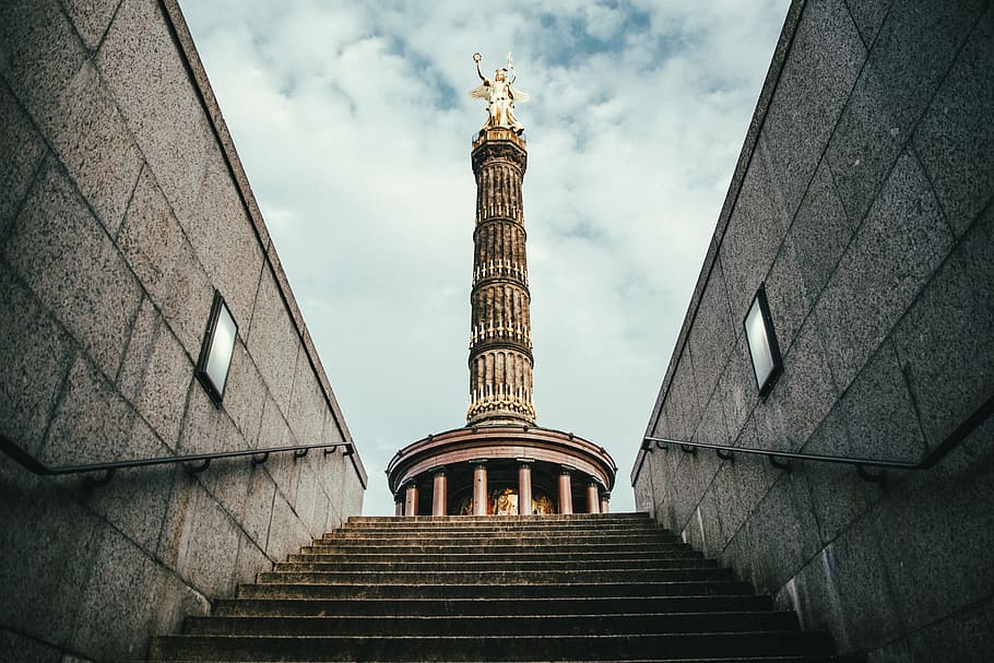 A view of Berlin Victory Column from downstairs with clouds in the background