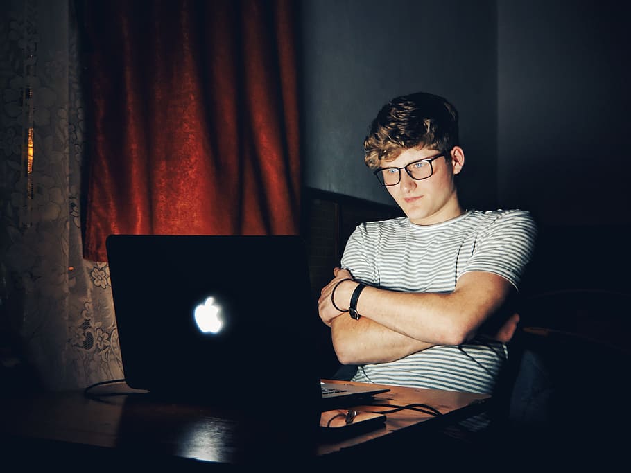 man looking at turned on MacBook, computer, laptop, one person HD wallpaper