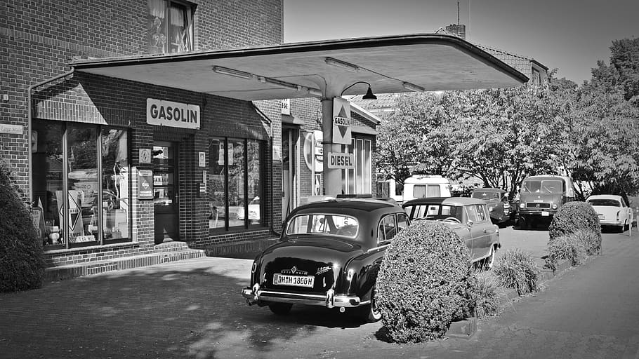 Two Cars Parked Near Gasolin Store, architecture, auto, black-and-white