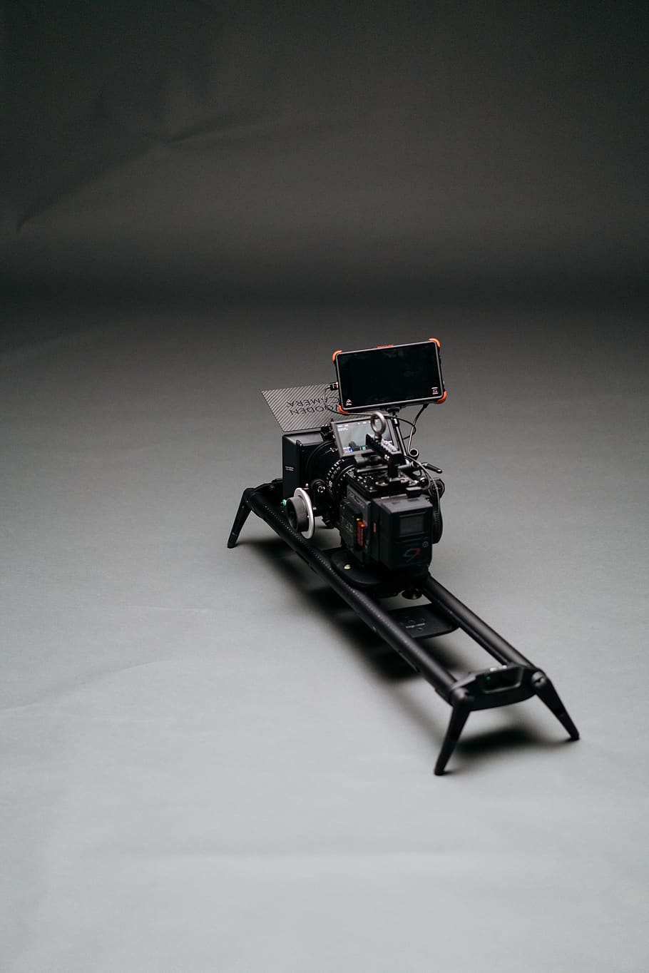 black video camera with slider, machine, chair, display, light HD wallpaper