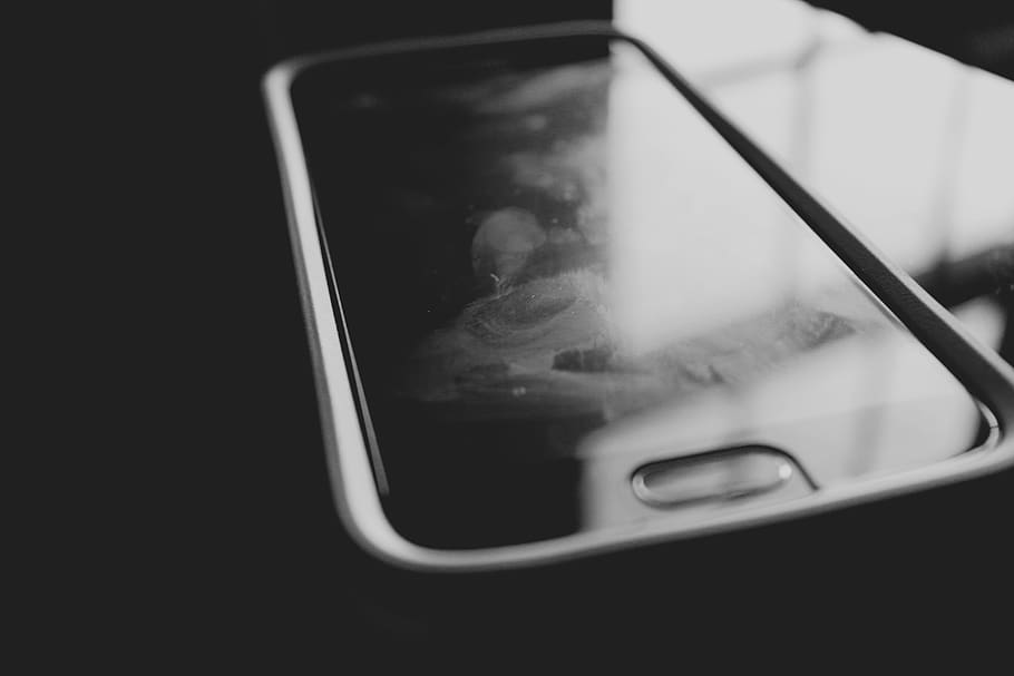 phone, black and white, cell phone, close-up, no people, indoors