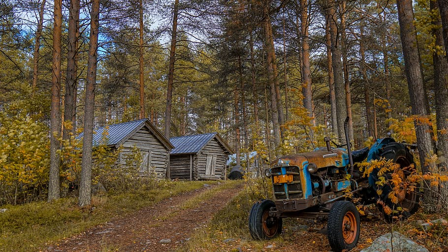 blue tractor beside cabin near trees, vehicle, transportation, HD wallpaper