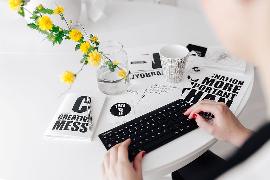 Female hands typing on the remote wireless computer keyboard HD wallpaper