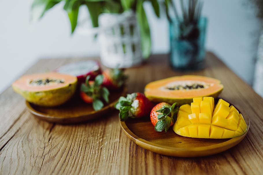 Exotic fruits on a wooden table, sweet, healthy, fresh, organic