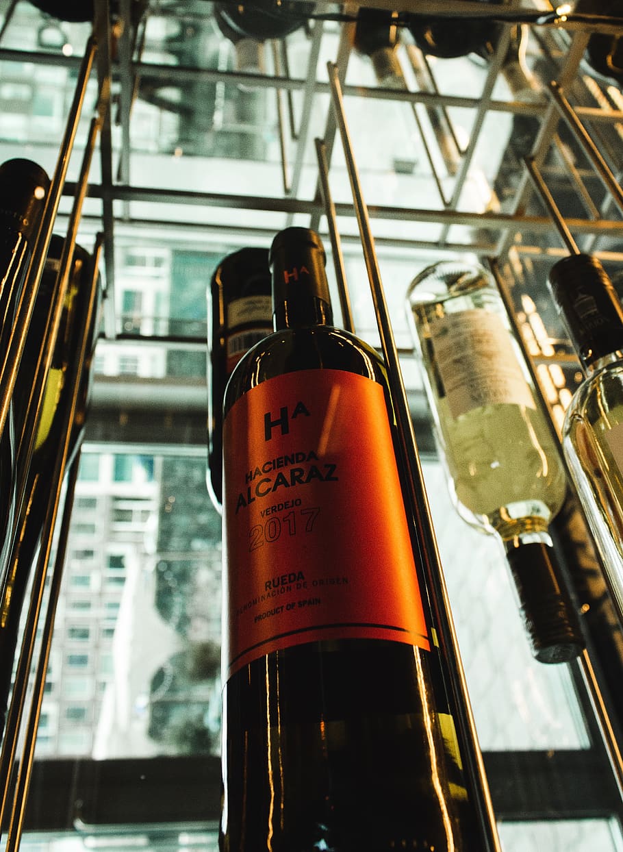orange labeled wine bottle, focus on foreground, no people, glass - material HD wallpaper