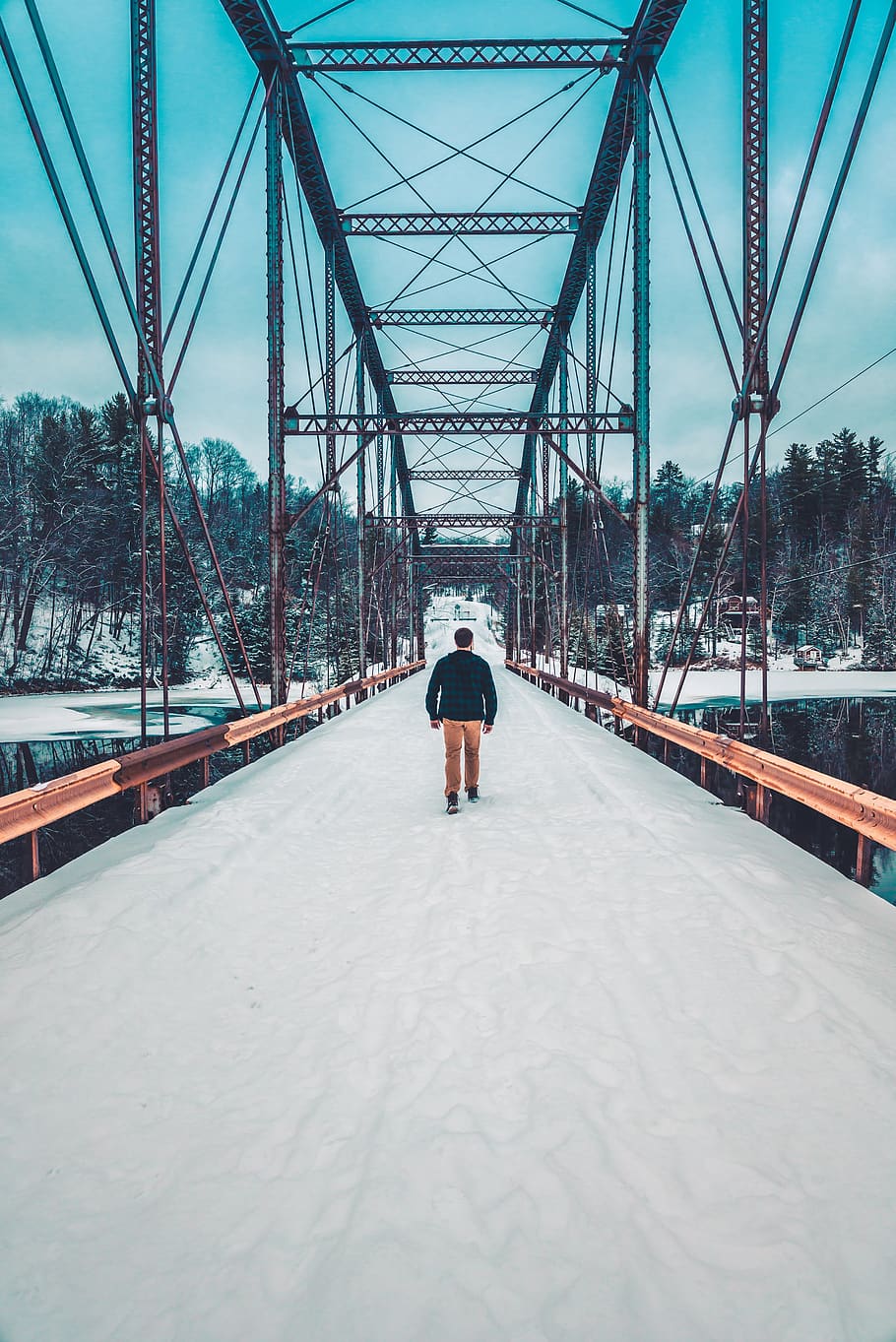 man walking on bridge during daytime, rear view, bridge - man made structure HD wallpaper