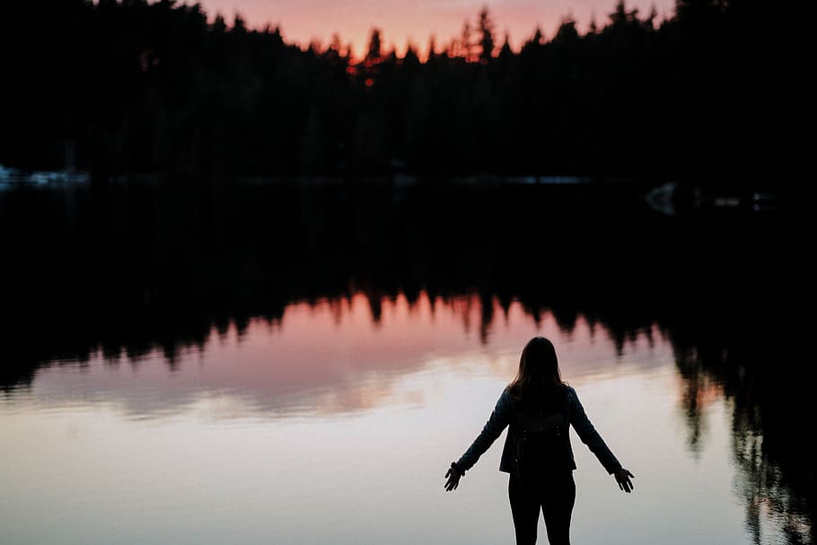 silhouette of person standing beside body of water, nature, human
