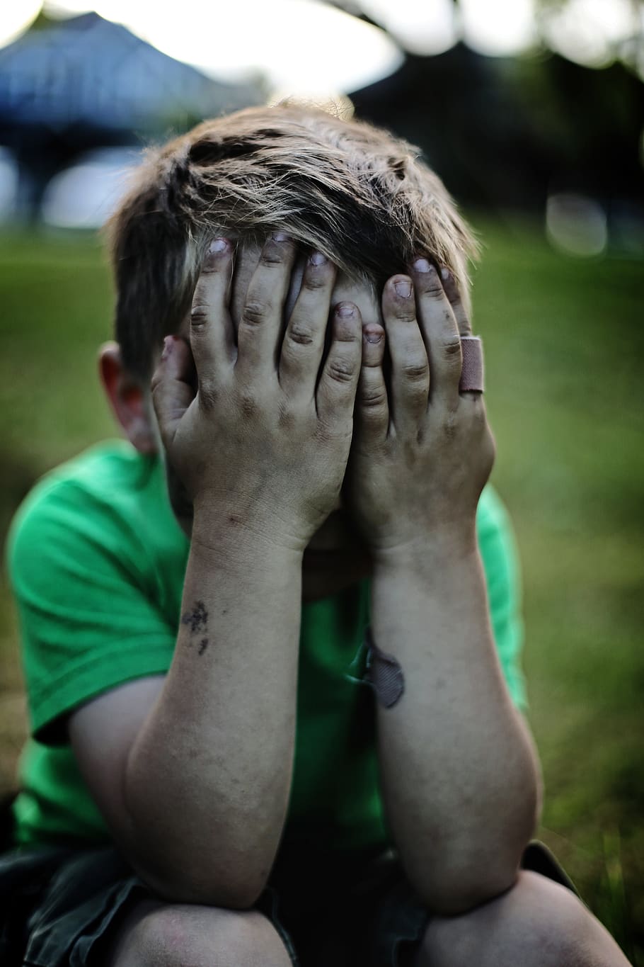 boy sitting while covering his face, one person, real people HD wallpaper
