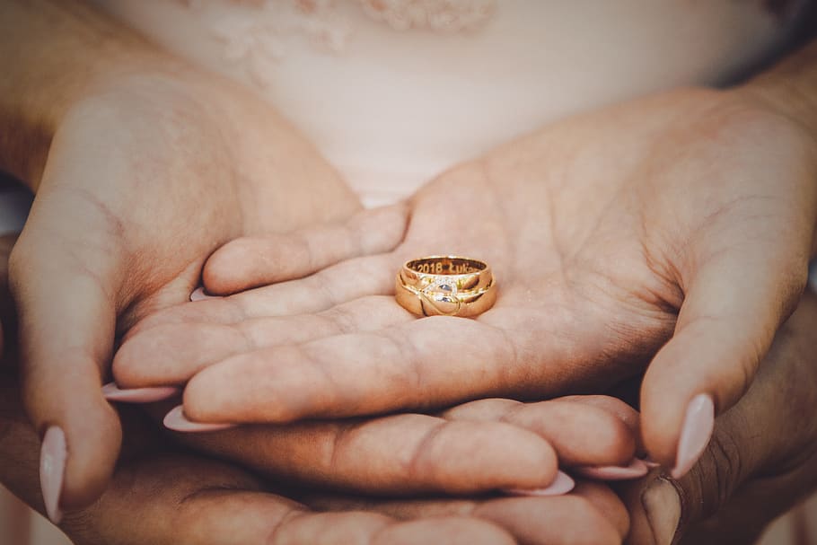 Premium AI Image | a gold wedding ring with a diamond ring on the top.