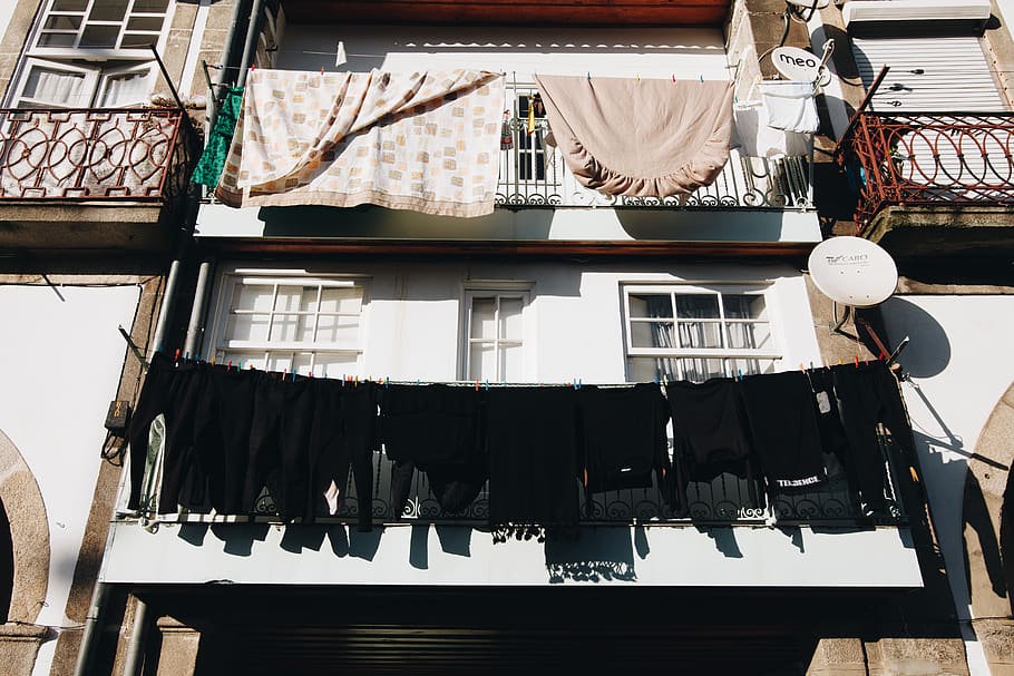 Close Up Photo of Black Clothes Hanged Outside Window, building HD wallpaper