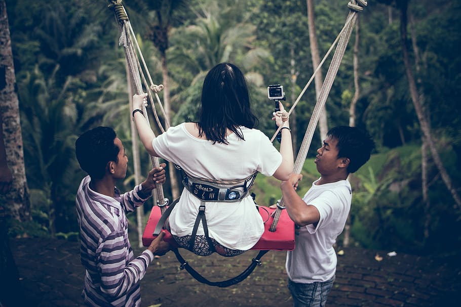 Two Men Assisting Woman Riding on Swing, camera, daytime, female HD wallpaper