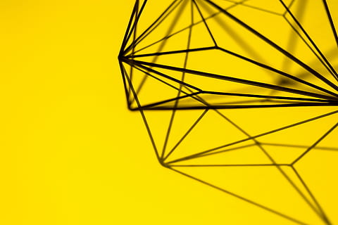 Geometric decoration on yellow background, texture, studio shot HD wallpaper